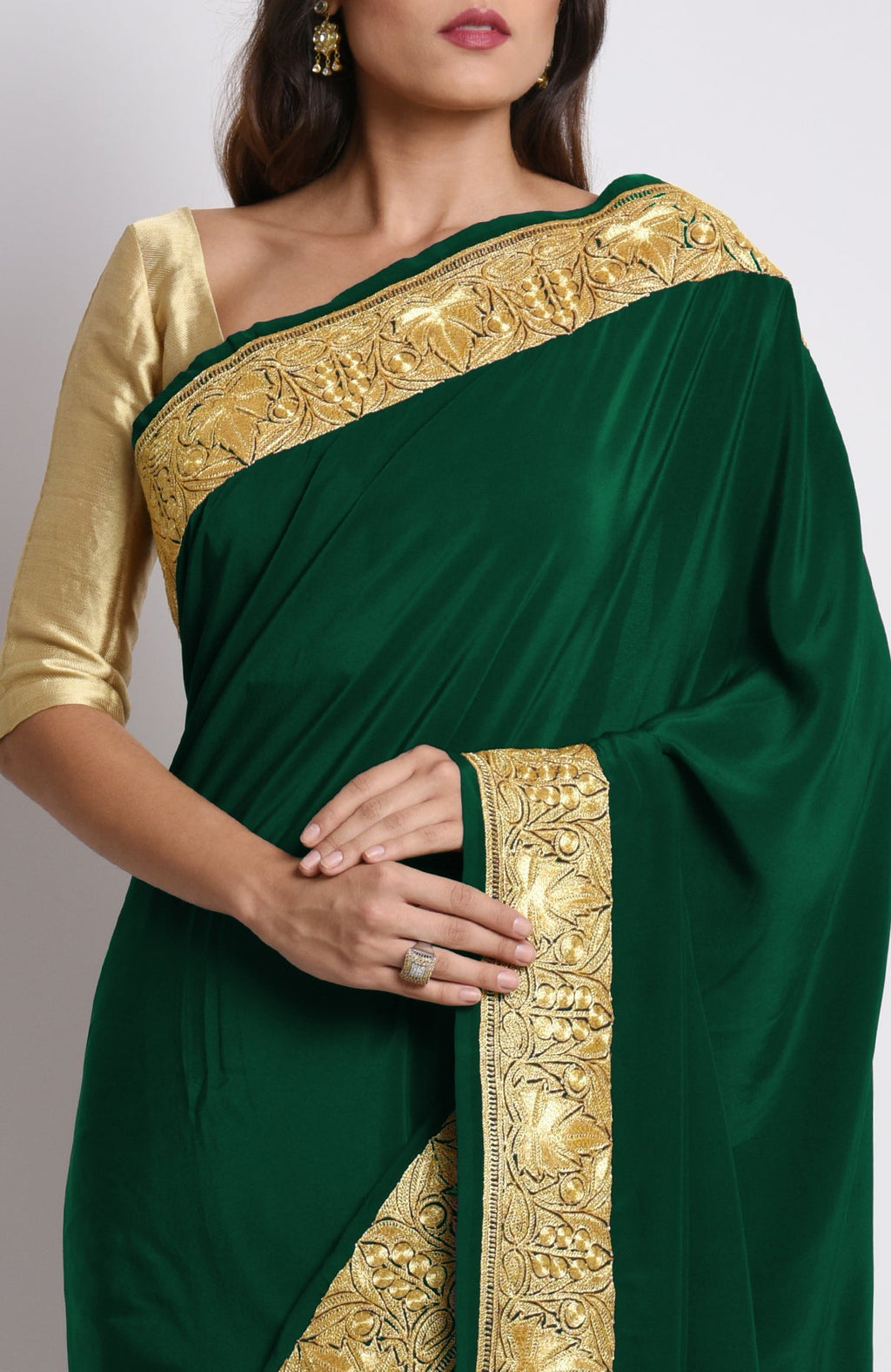 Emerald pure crepe saree with gold Kashmiri tilla embroidery on pallav and borders