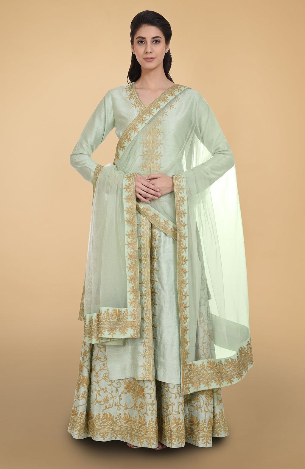 Sage green raw silk lehenga set with gold Kashmiri tilla aari embroidery and net dupatta.