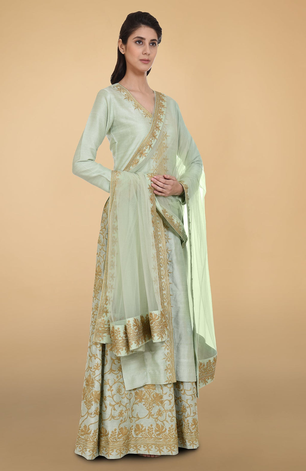 Sage green raw silk lehenga set with gold Kashmiri tilla aari embroidery and net dupatta
