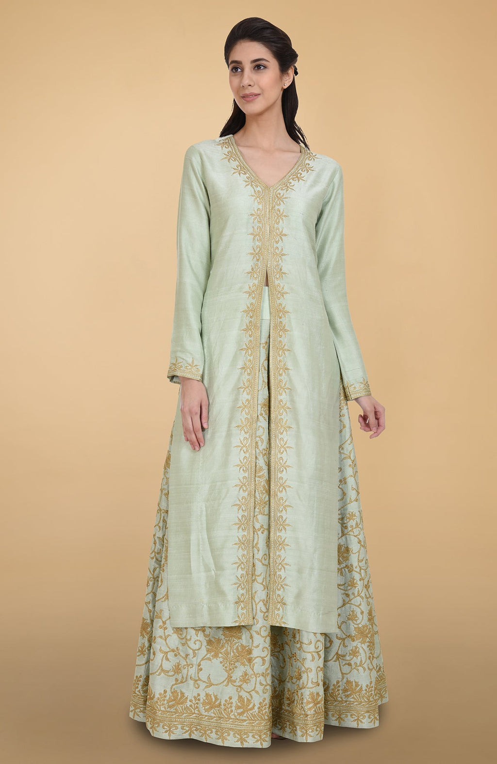 Sage green raw silk lehenga set with gold Kashmiri tilla aari embroidery and net dupatta.