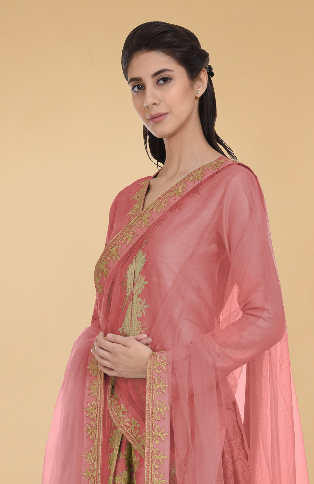 Peach echo raw silk lehenga set with gold Kashmiri tilla aari embroidery and net dupatta.