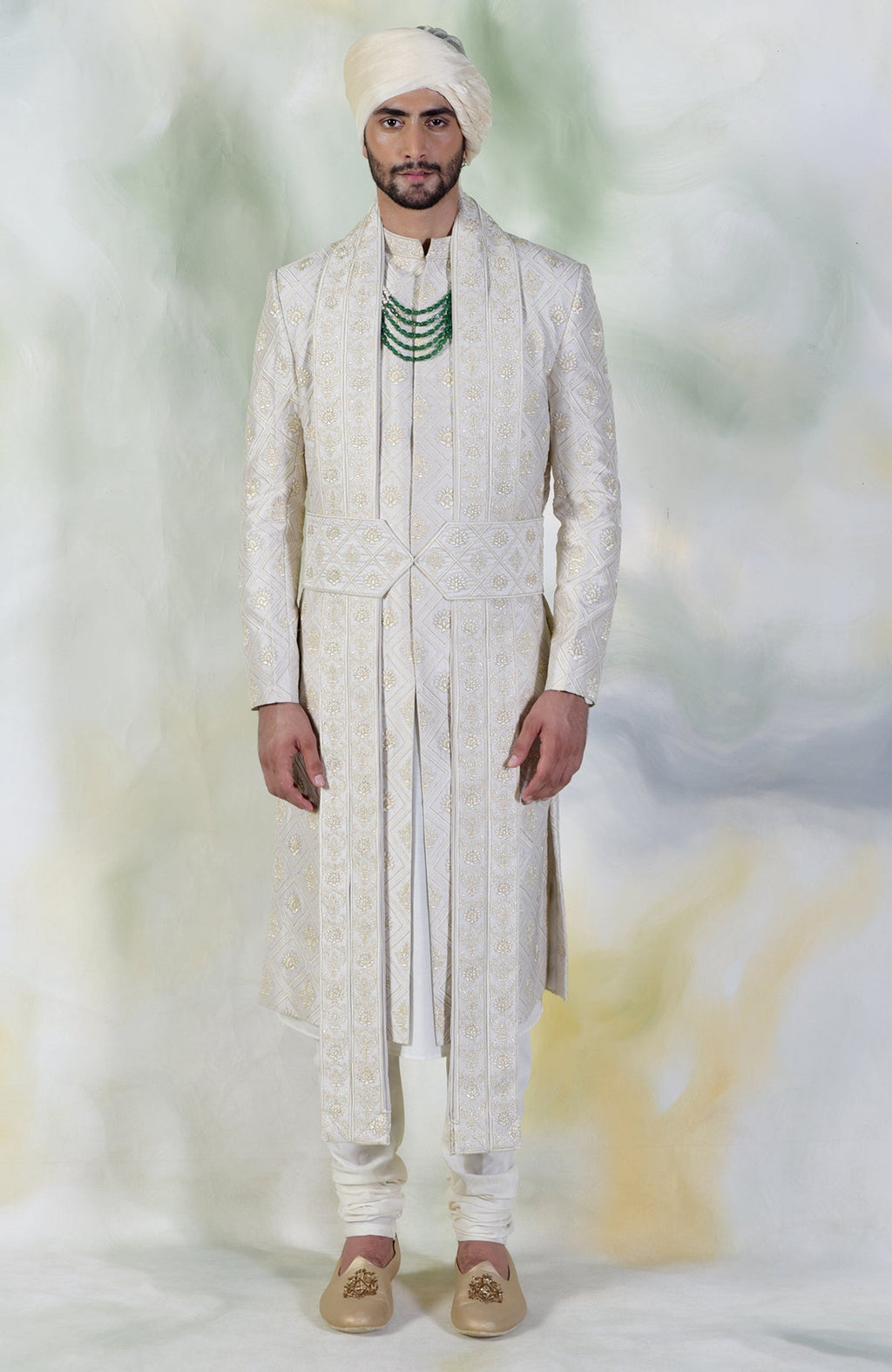 Ivory sherwani set with geometric and floral embroidery in silk and gold tilla accents