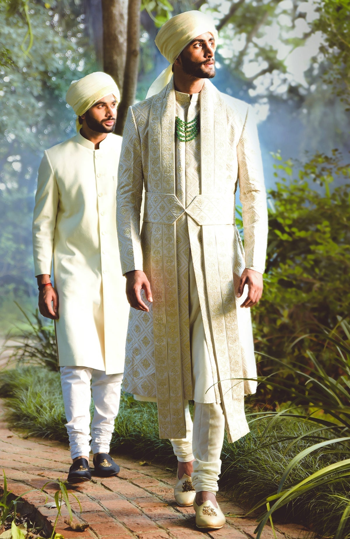 Ivory sherwani set with geometric and floral embroidery in silk and gold tilla accents.