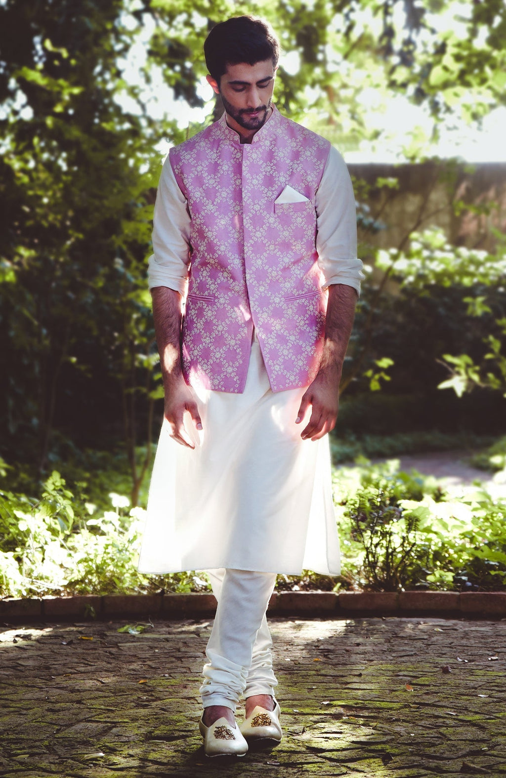 Onion pink silk bandi jacket with beige and ivory floral embroidery and tonal buttons.