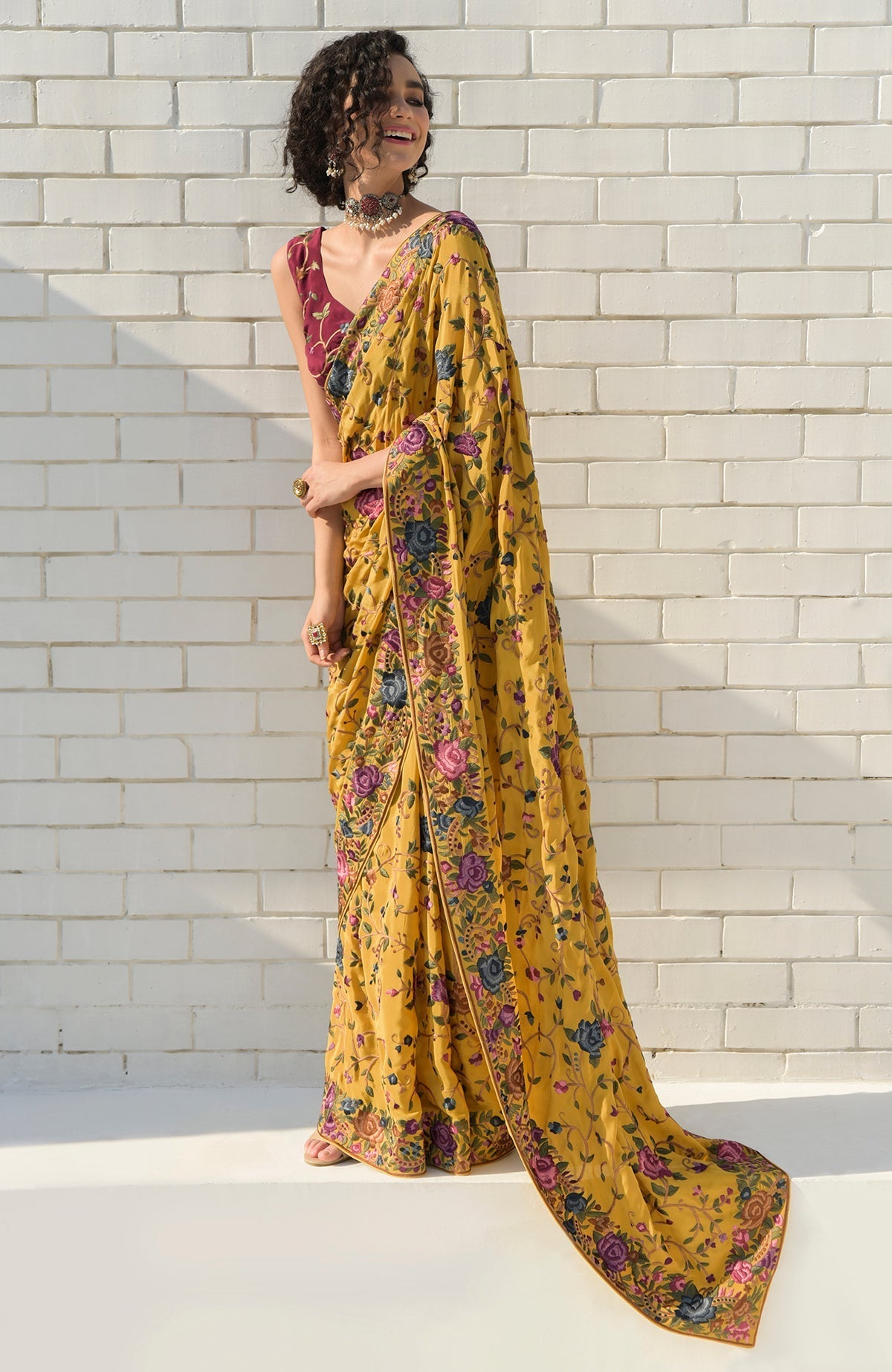 Masterpiece Calendula floral saree with hand embroidered Parsi Gara motifs and wine blouse piece