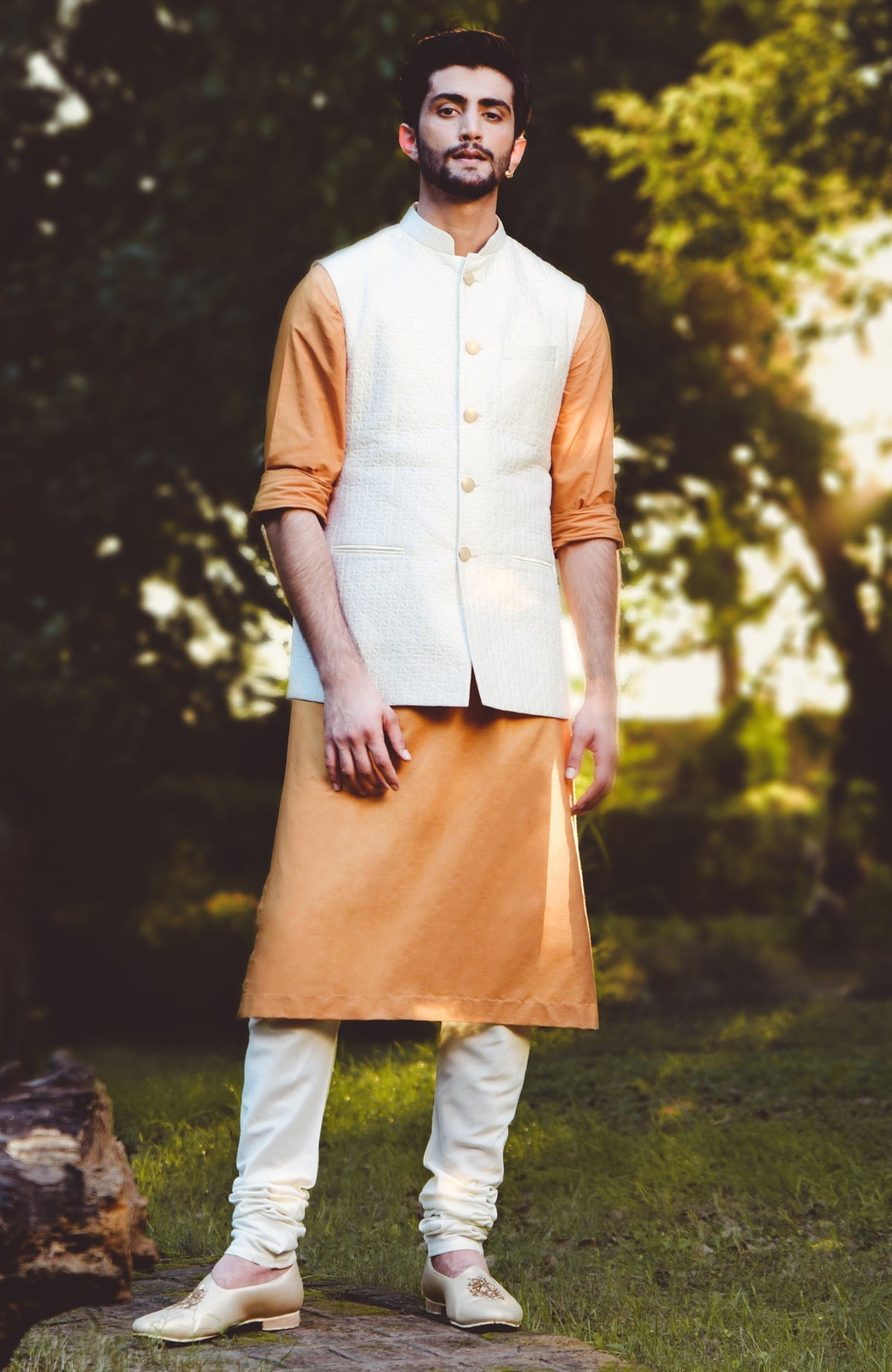 Ivory micro-quilted raw silk bandi jacket with gold buttons in classic minimalist style