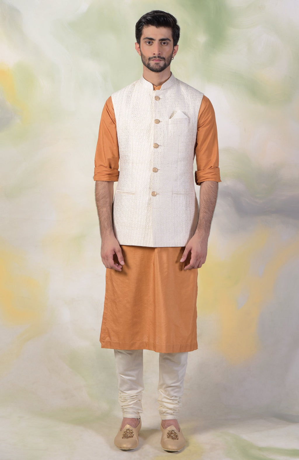 Ivory micro-quilted raw silk bandi jacket with gold buttons in a minimalist style