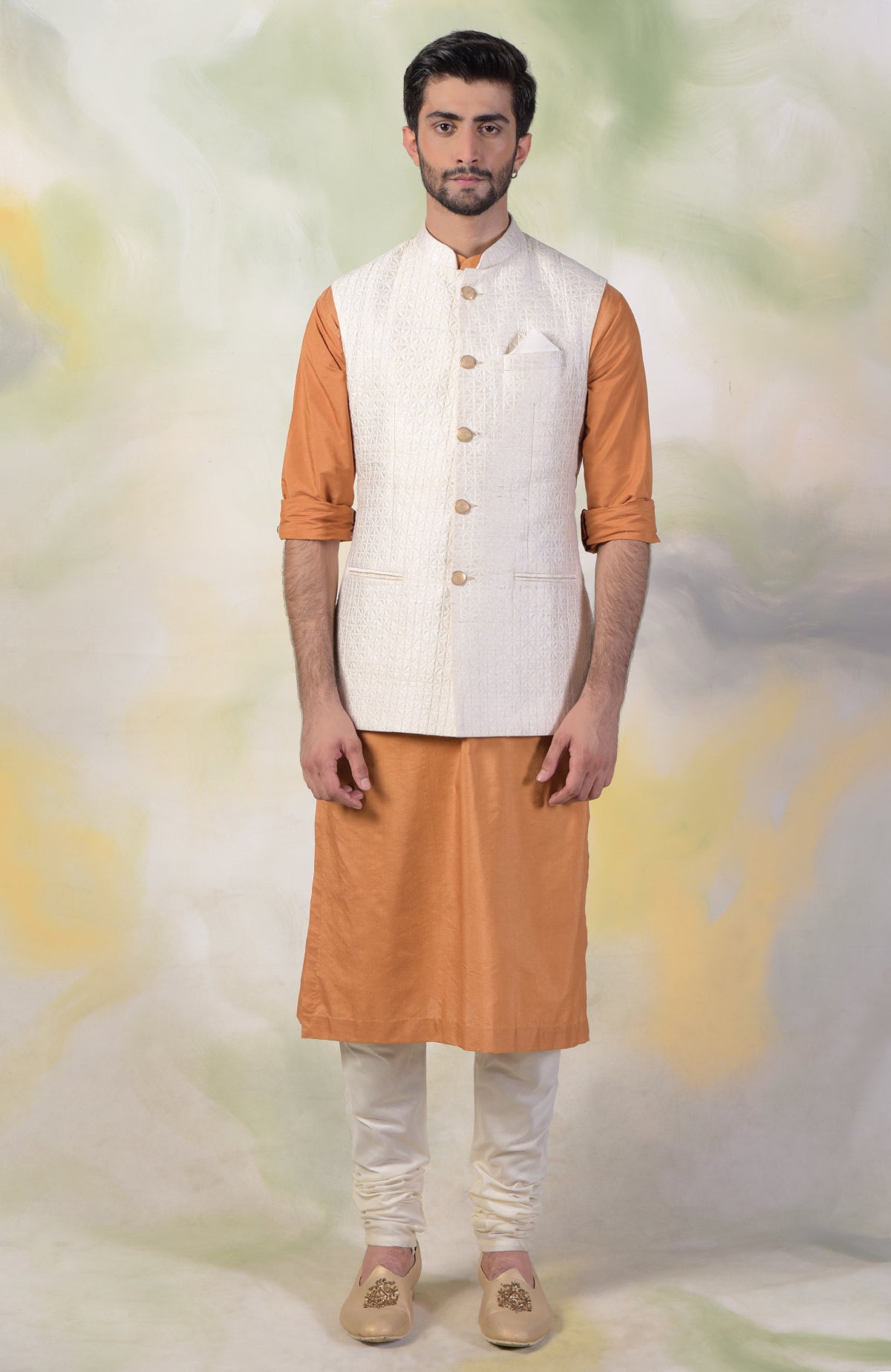 Ivory micro-quilted silk bandi jacket with gold buttons and classic minimalist design