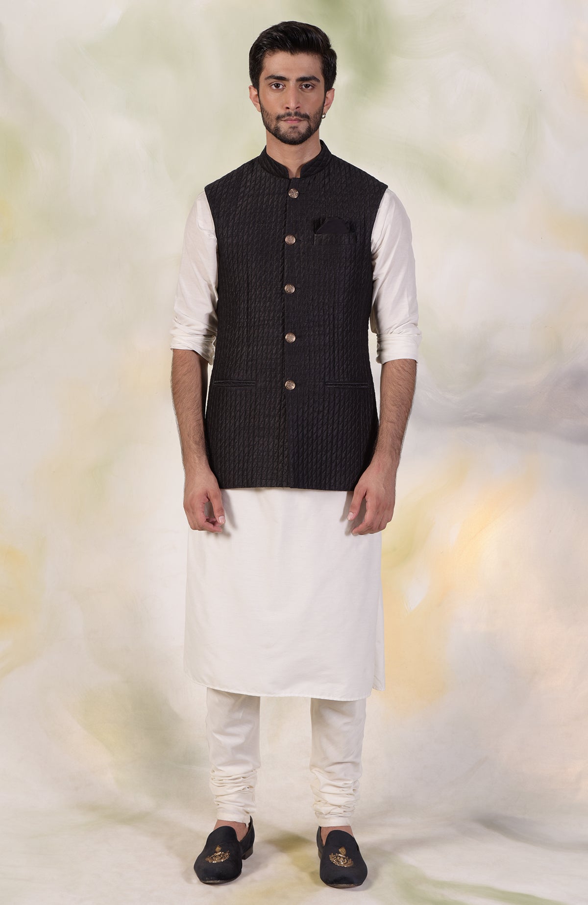 Black micro-quilted silk bandi jacket with gold buttons and classic minimalist design