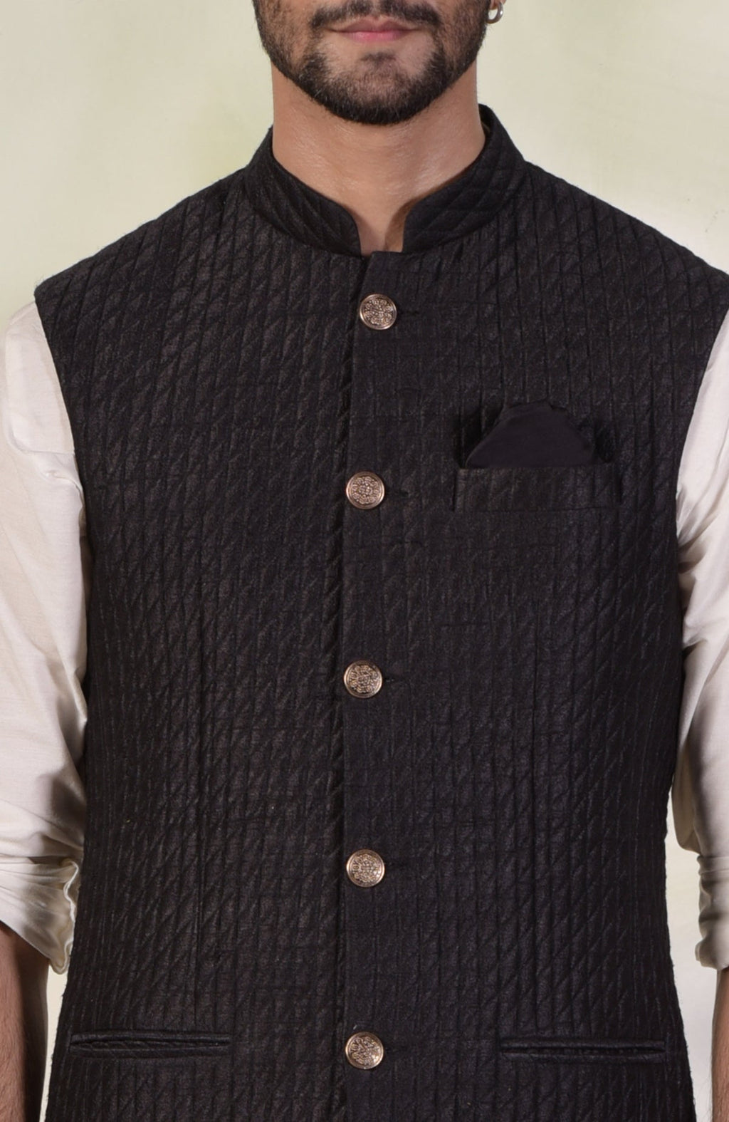 Black micro-quilted raw silk bandi jacket with gold buttons in a classic minimalist style