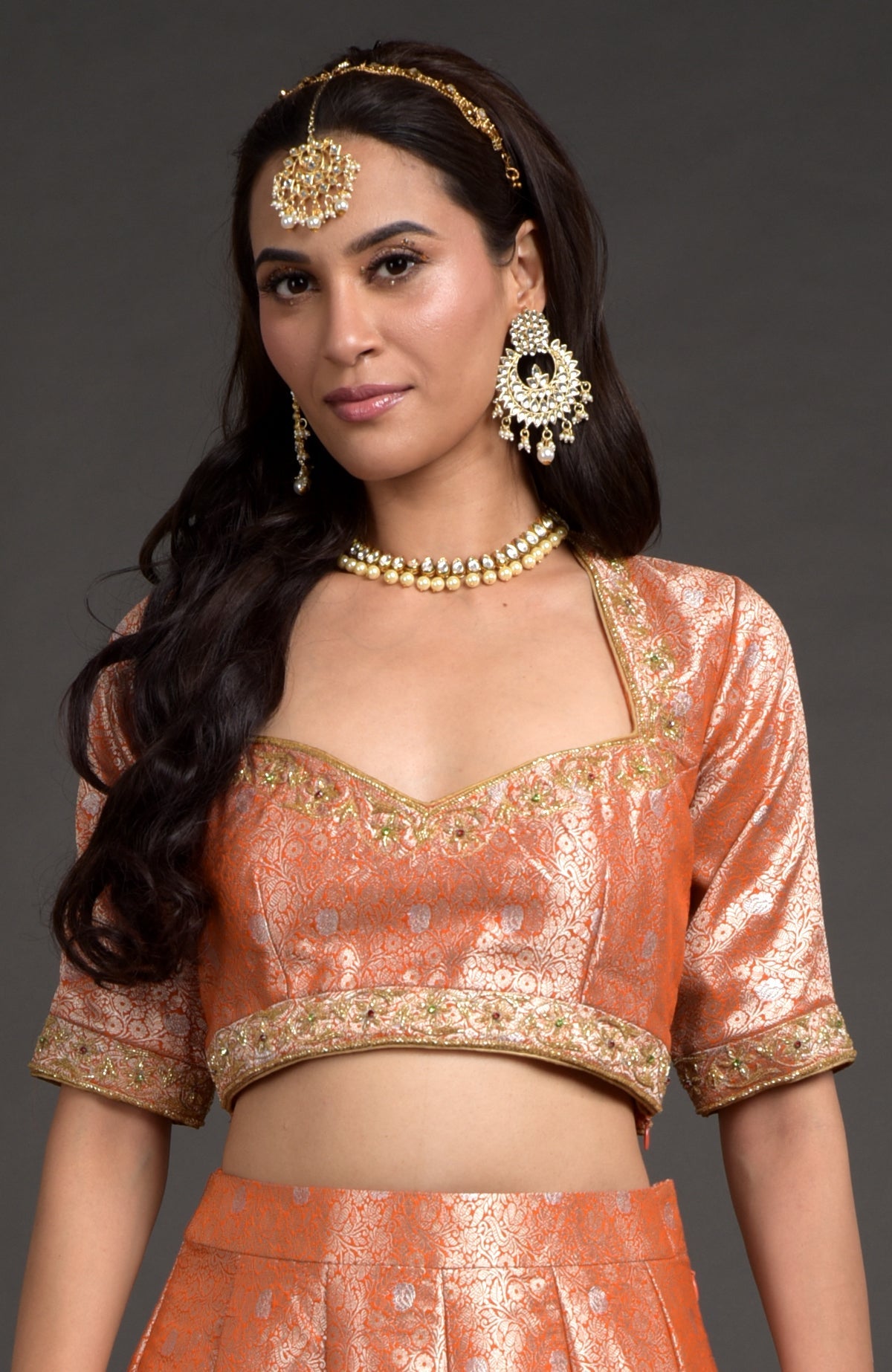 Orange-gold Benarasi blouse with zardozi floral embroidery and beadwork on neckline and sleeves