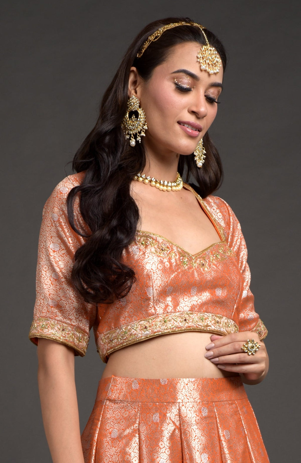 Orange-gold Benarasi blouse with zardozi floral embroidery and cut bead details