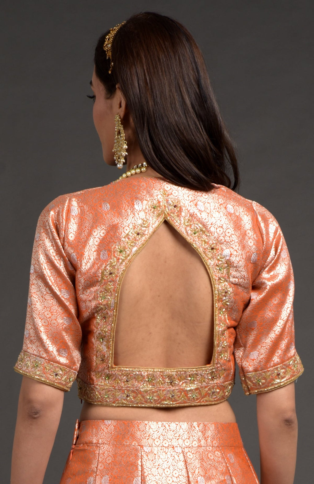 Orange-gold Benarasi blouse with zardozi floral embroidery and cut bead details