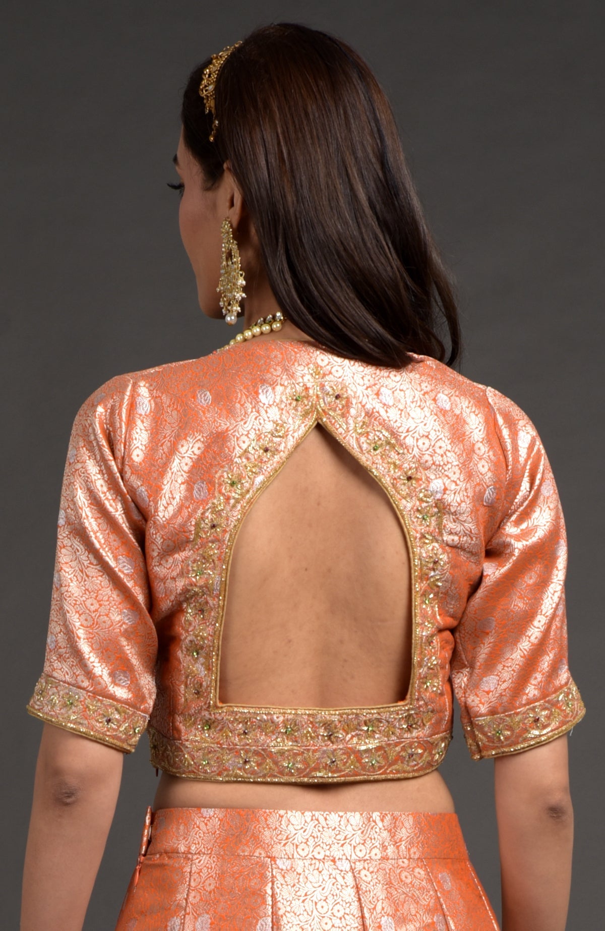 Orange-gold Benarasi blouse with zardozi floral embroidery and cut bead details