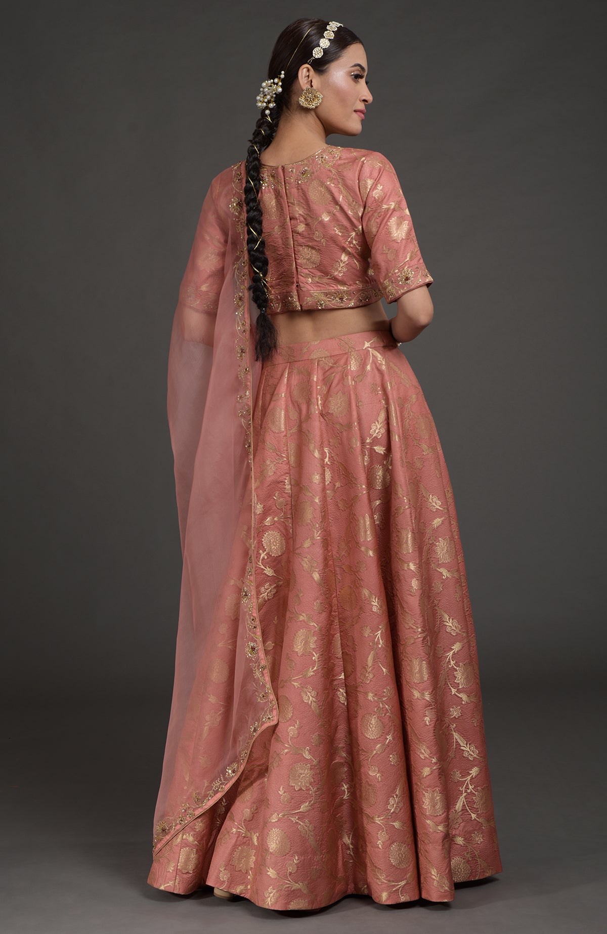 Desert rose-gold Benarasi lehenga set with zardozi embroidery on blouse, dupatta, and skirt panels