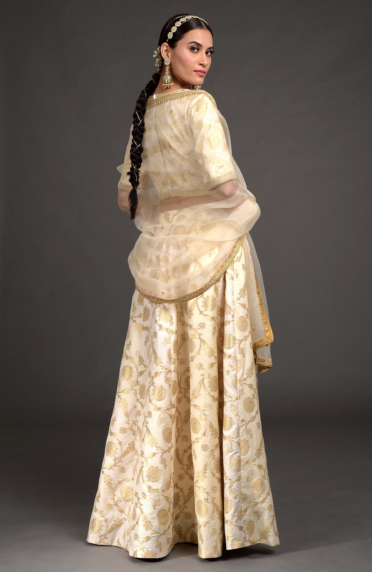 Ivory lehenga set with gold Benares weave and silver gold zardozi embroidery on blouse and dupatta