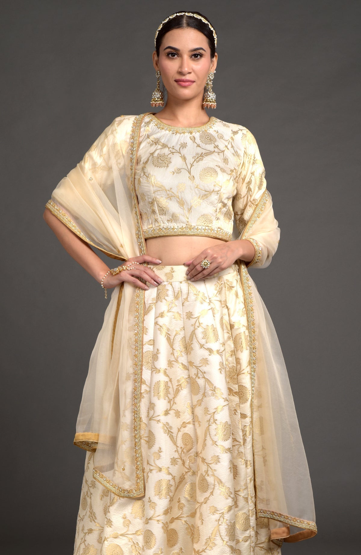 Ivory and gold Benarasi lehenga set with zardozi embroidery, blouse, and dupatta with beaded borders
