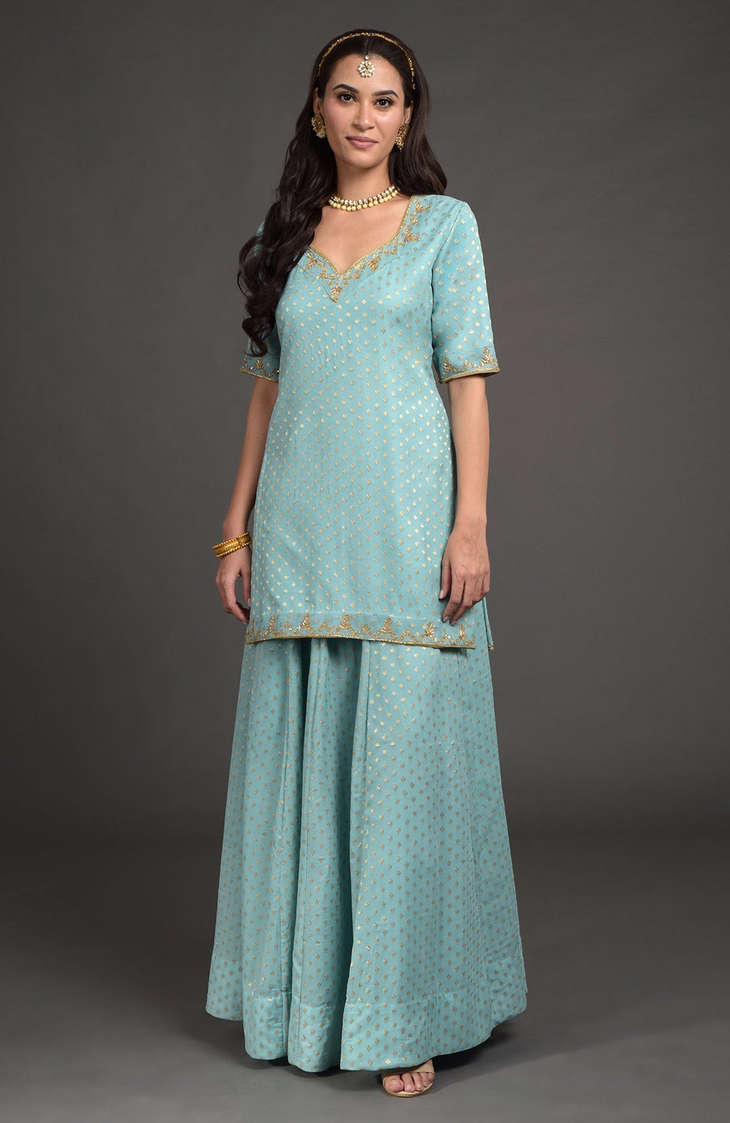 Aqua haze lehenga set with gold Benares weave and floral zardozi embroidery on tunic and dupatta