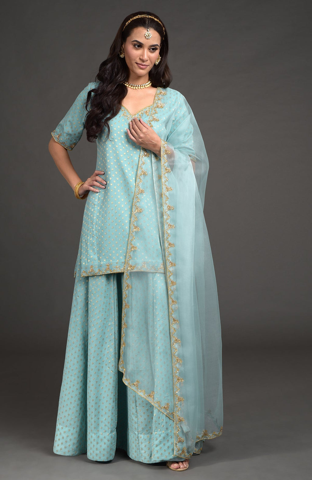 Aqua haze lehenga set with gold Benares weave and zardozi floral embroidery on tunic and dupatta