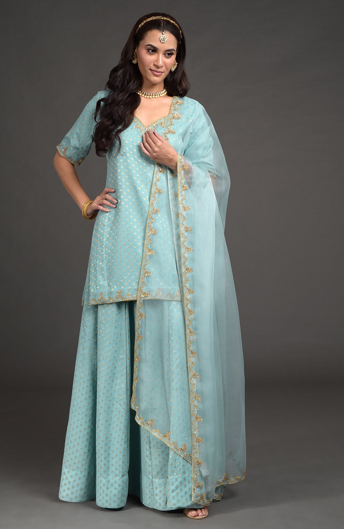 Aqua haze lehenga set with gold Benares weave and zardozi floral embroidery on tunic and dupatta