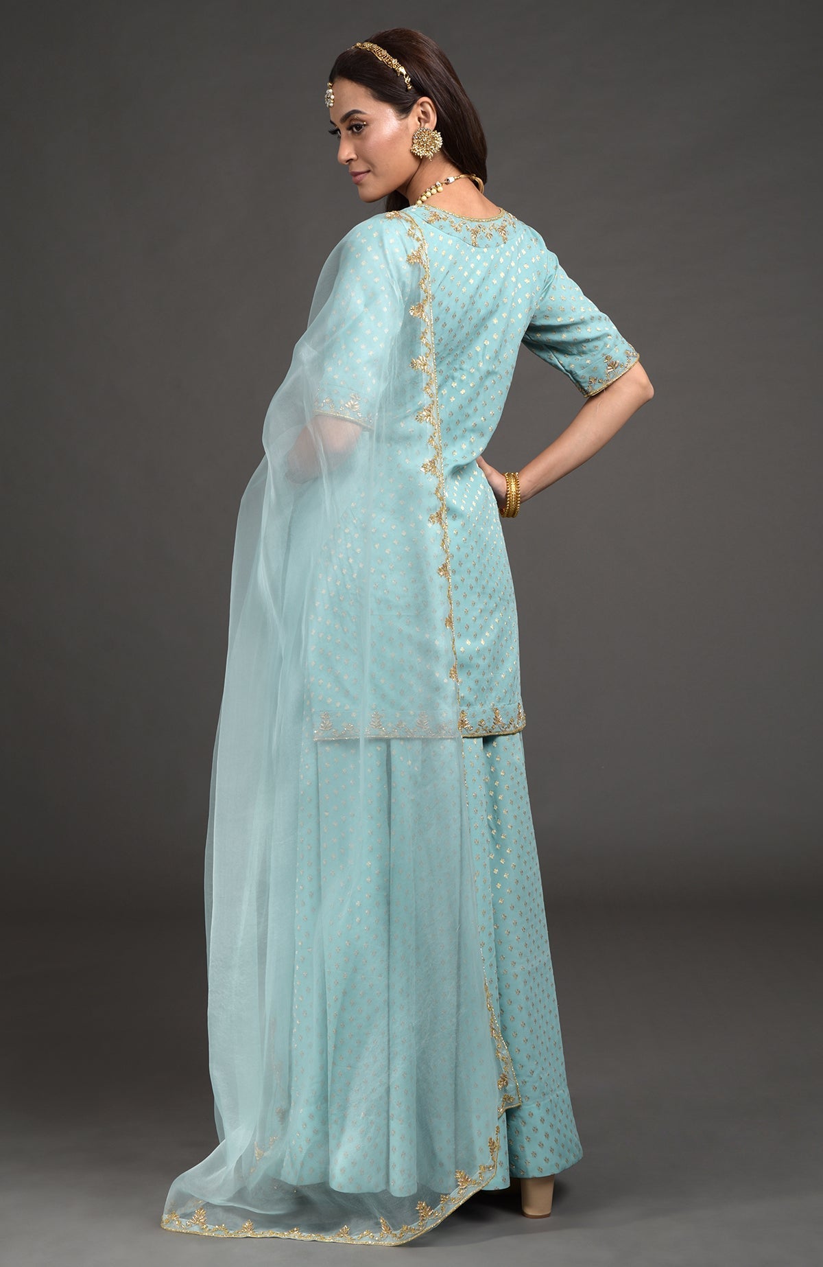 Aqua haze lehenga set with gold Benarasi weave and hand embroidered zardozi floral designs.