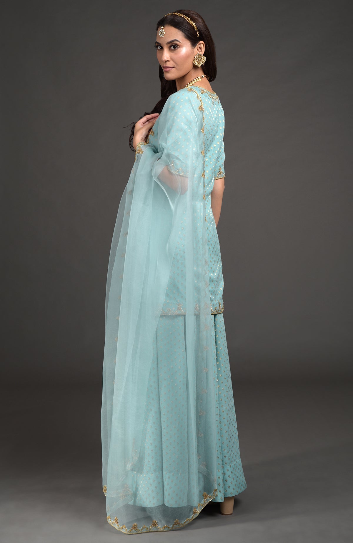 Aqua haze lehenga set with gold Benares weave and floral zardozi hand embroidery