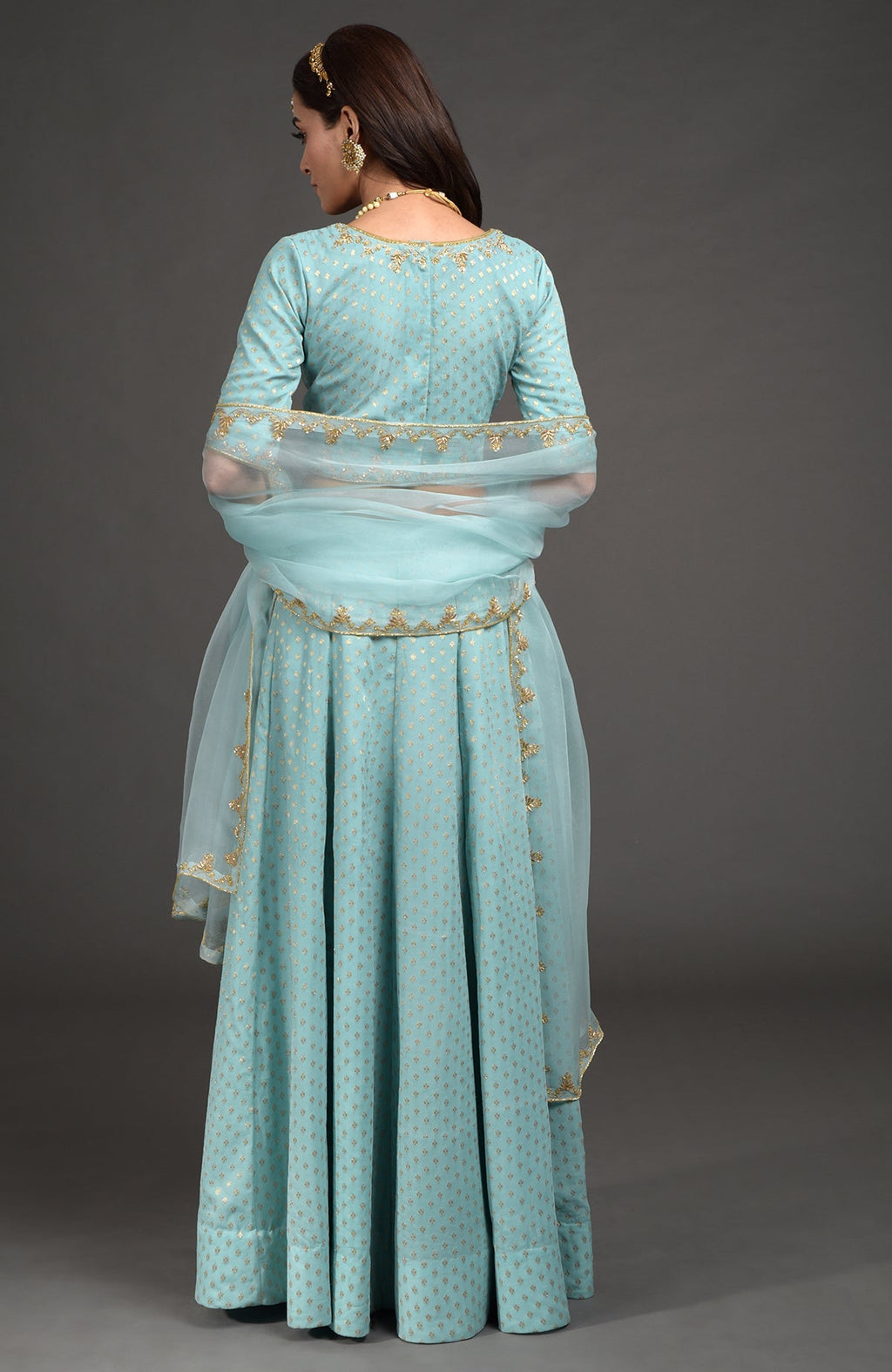 Aqua haze lehenga set with gold Benares weave and floral zardozi hand embroidery.