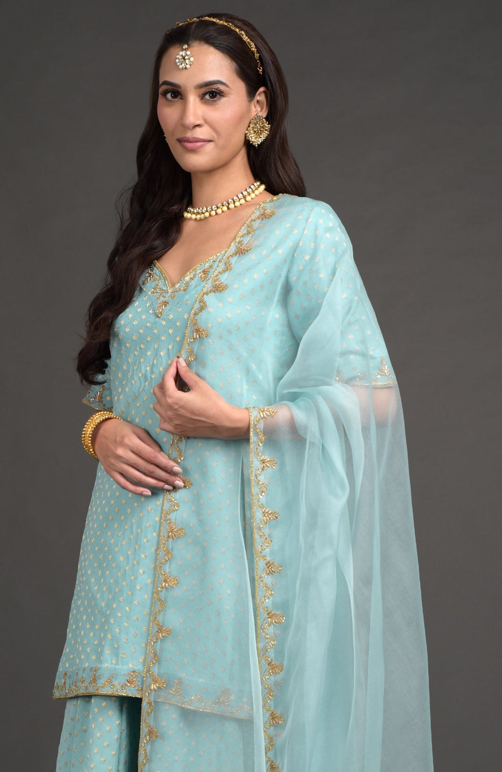 Aqua haze lehenga set with gold Benares weave and floral zardozi hand embroidery on tunic and dupatta