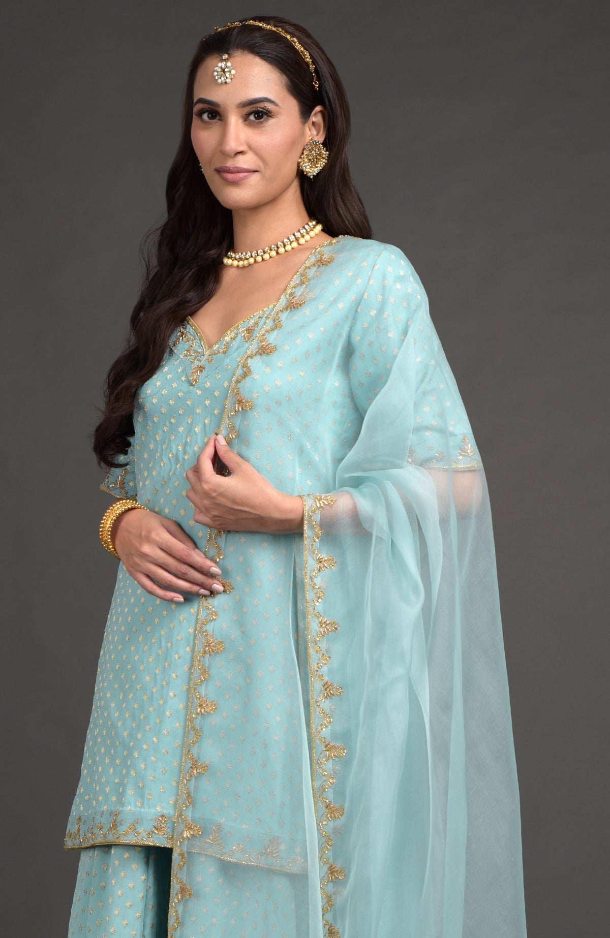 Aqua haze lehenga set with gold Benares weave and floral zardozi hand embroidery on tunic and dupatta