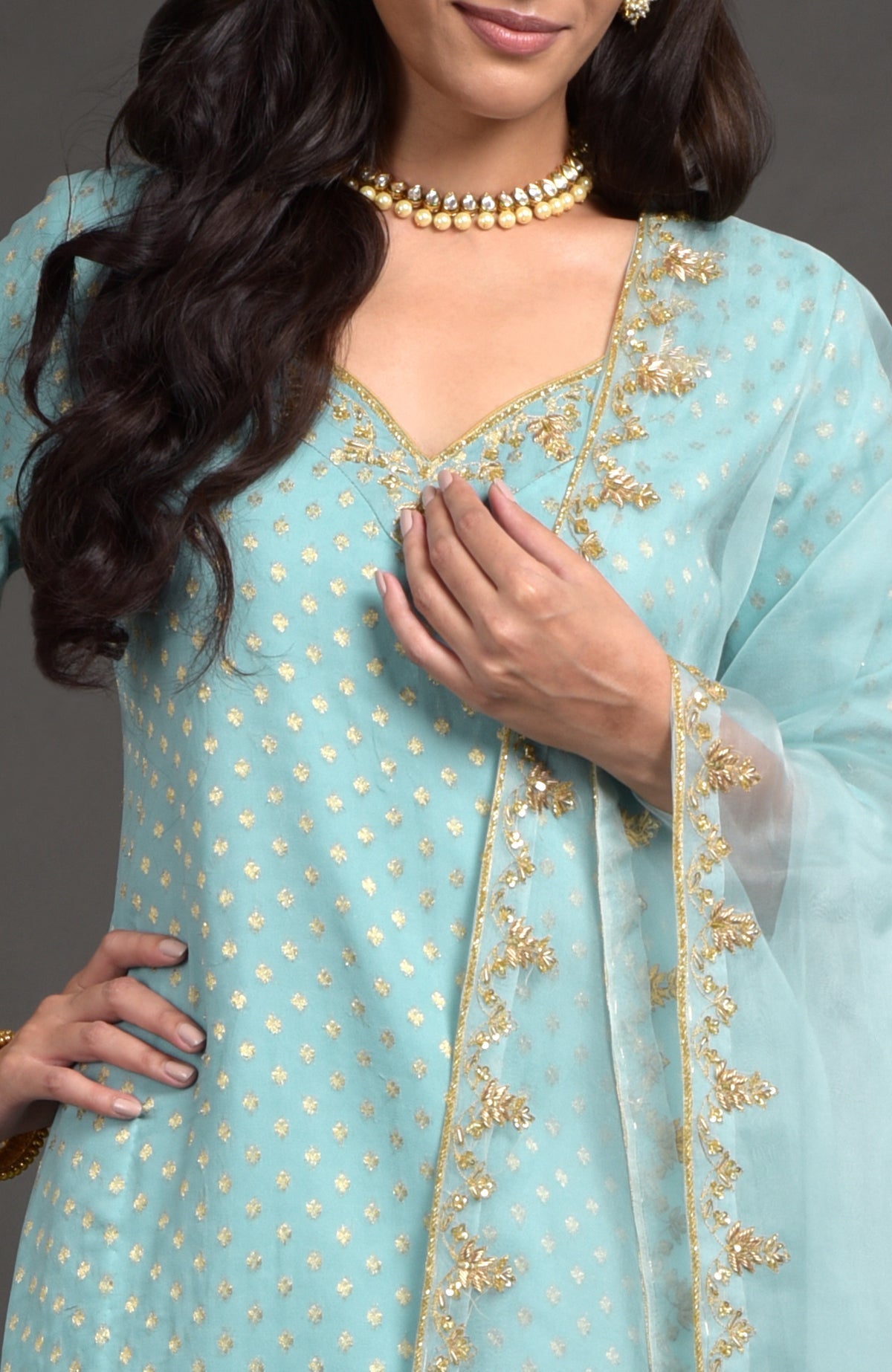 Aqua haze lehenga set with gold Benares weave and floral zardozi embroidery on tunic and dupatta