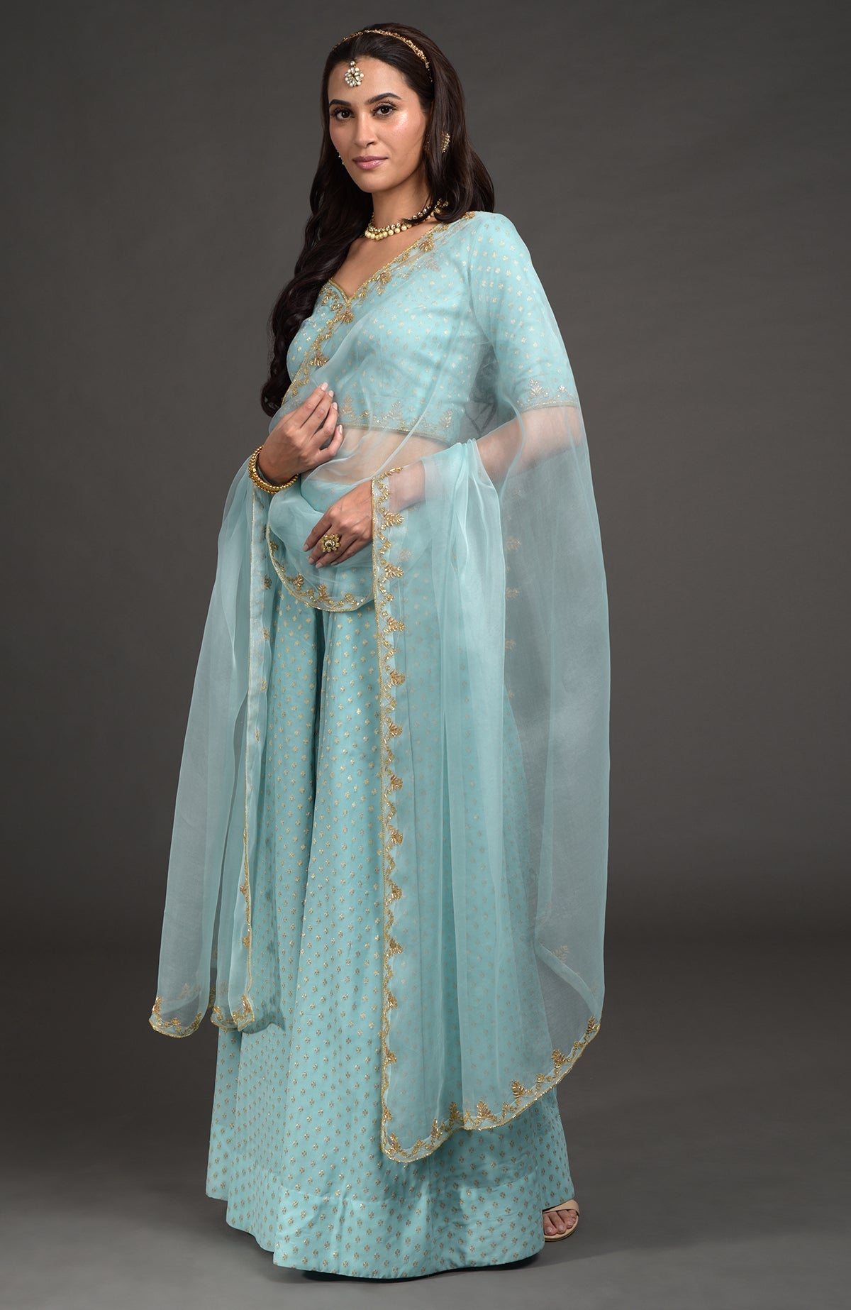 Aqua haze lehenga set with gold Benares weave and floral zardozi hand embroidery