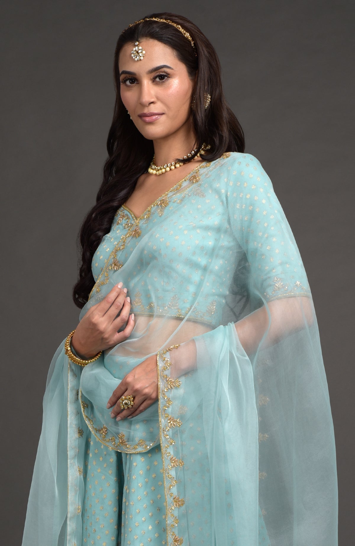Aqua haze lehenga set with gold Benares weave and floral zardozi hand embroidery on blouse and dupatta