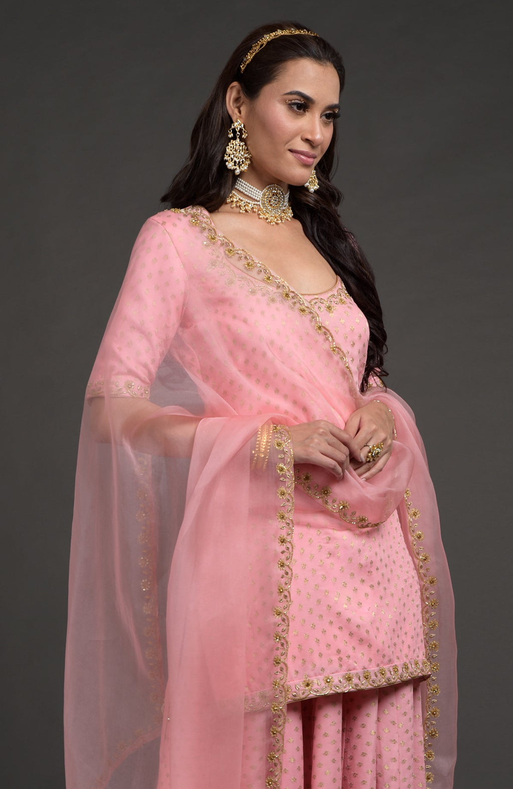 Strawberry pink Benarasi lehenga set with gold zardozi embroidery and floral beadwork dupatta.