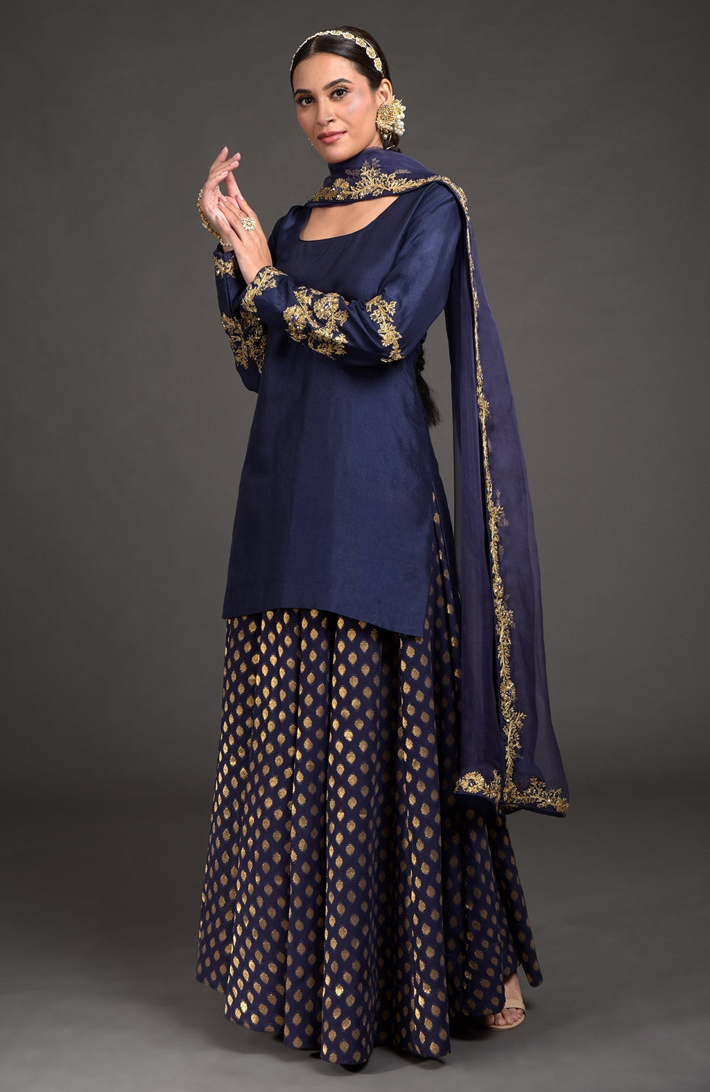 Eclipse blue lehenga set with gold zardozi embroidery on Benares weave fabric and dupatta.
