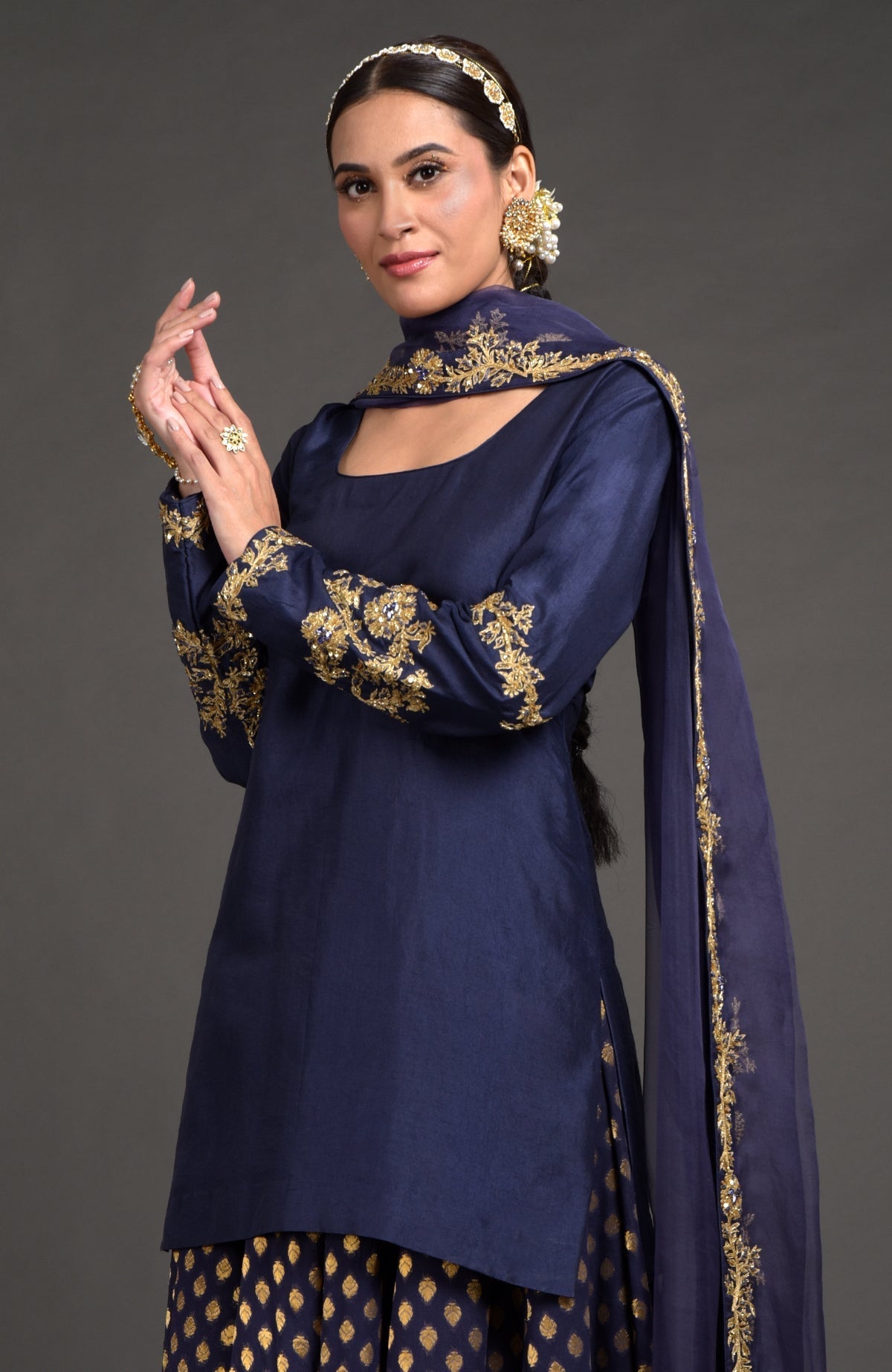 Eclipse blue lehenga set with gold zardozi embroidery on Benares weave fabric and matching dupatta.
