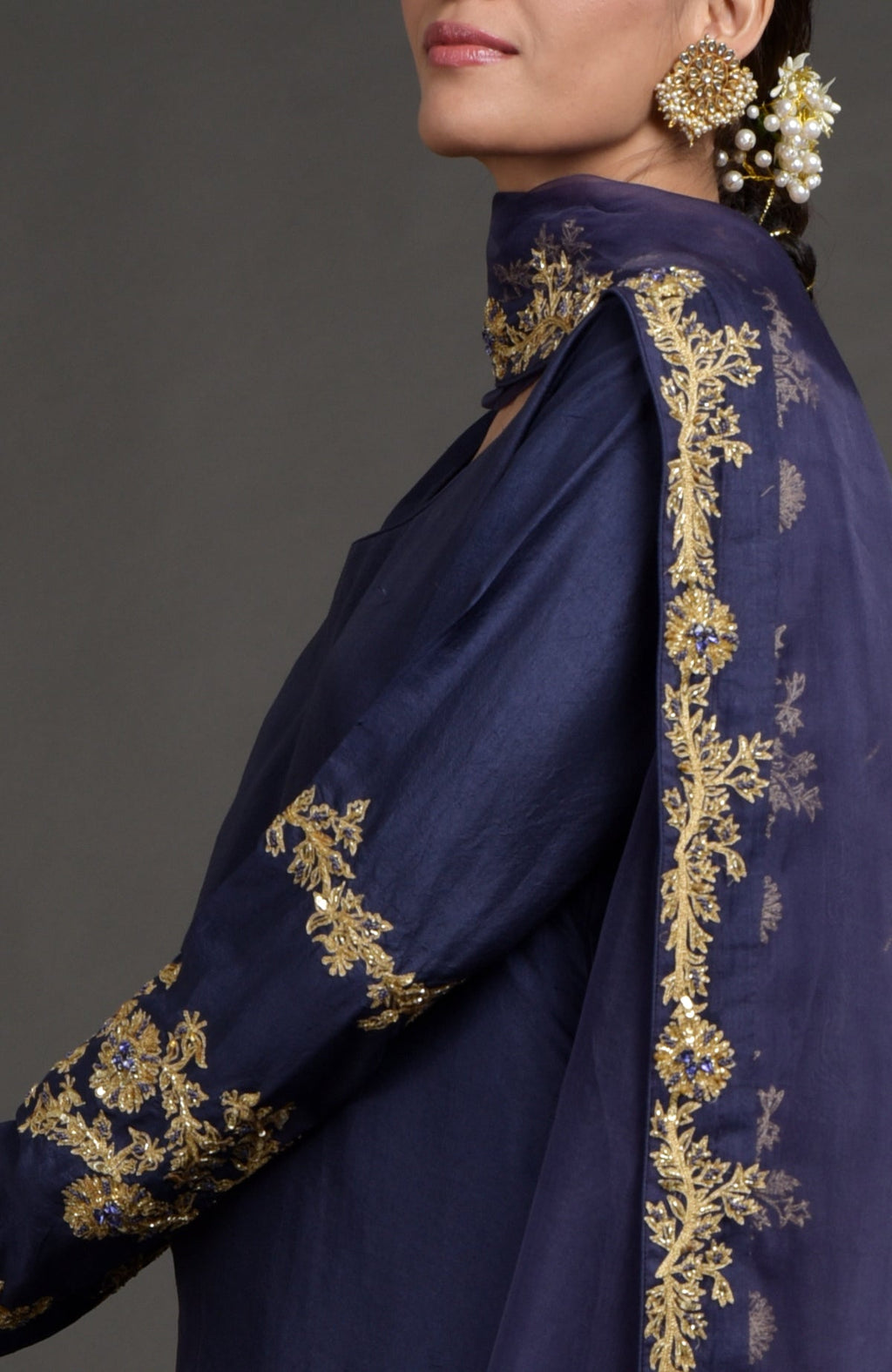 Eclipse blue lehenga set with gold zardozi embroidery on woven Benares fabric and matching dupatta.