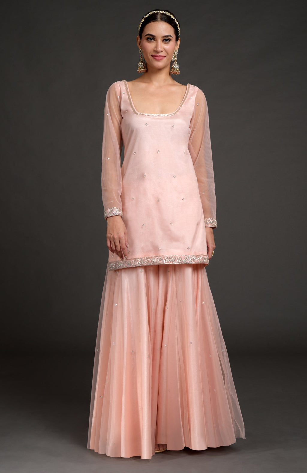 Nude pink tulle sharara set with zardozi embroidery on kurta, sleeves, and flared pants.