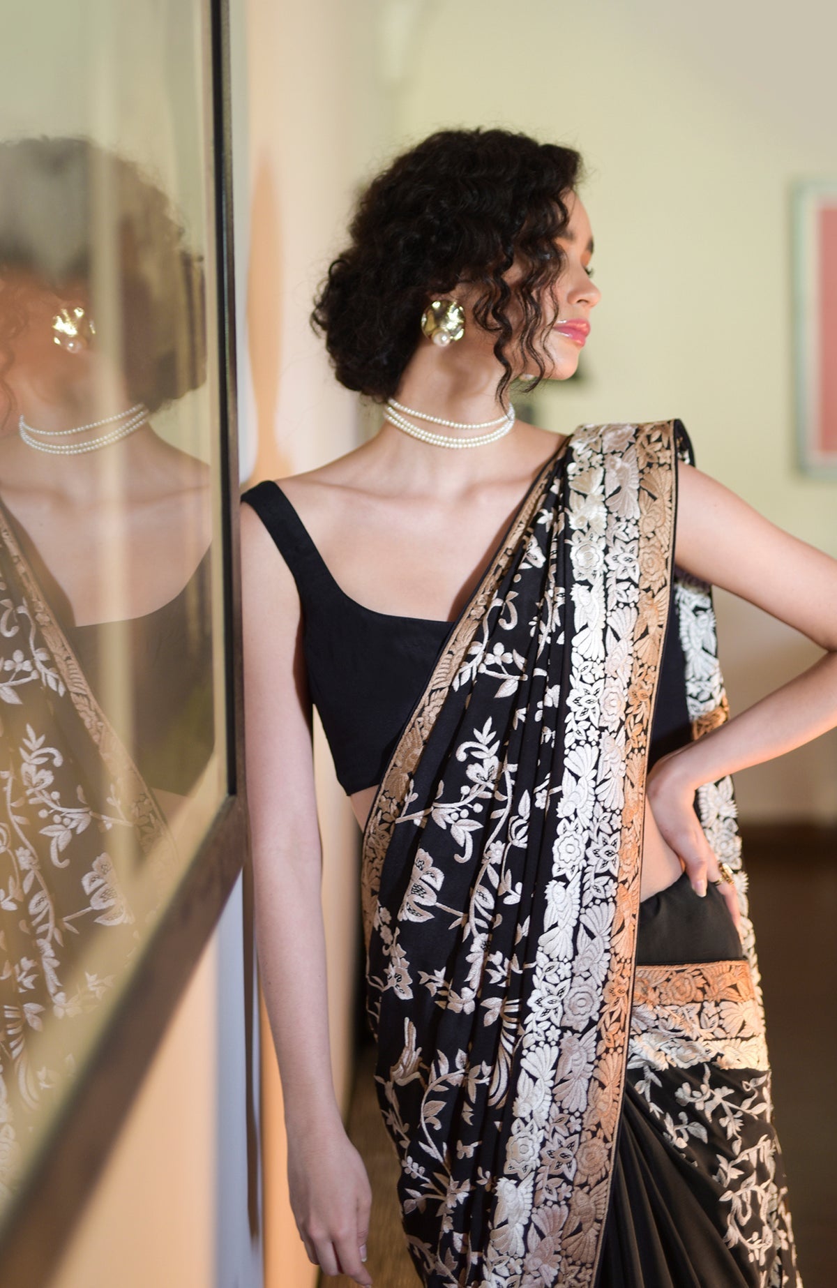 Black saree with hand-embroidered Parsi Gara birds and floral motifs and three-tier border