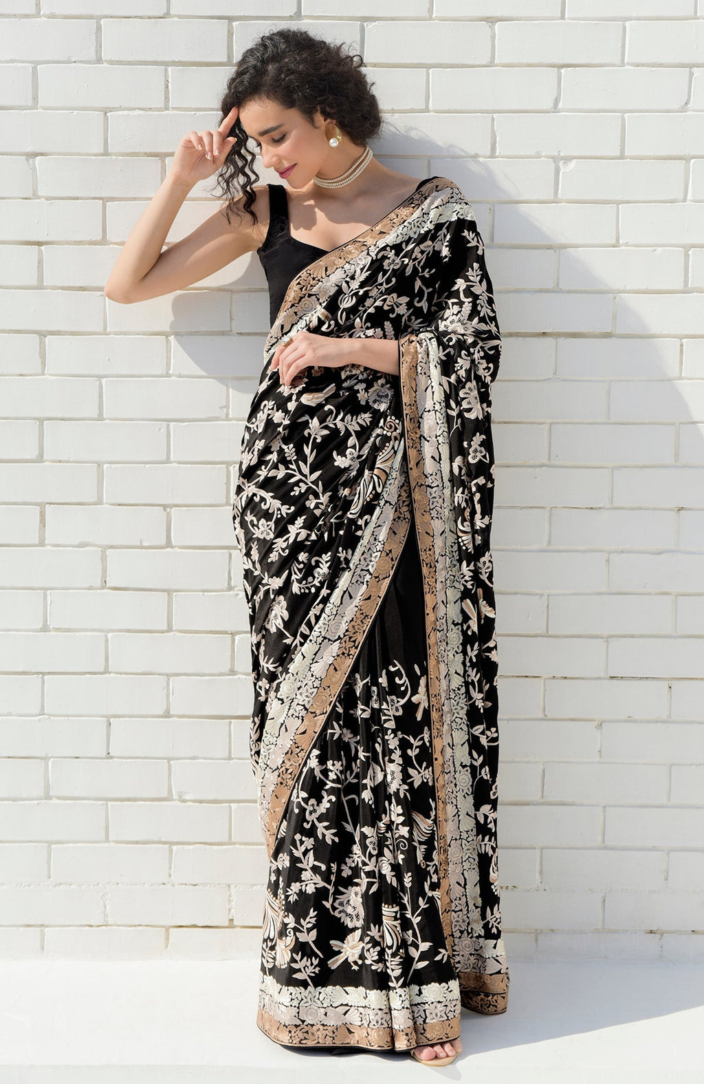 Black saree with hand-embroidered Parsi Gara motifs and three-tier pearl and cream border