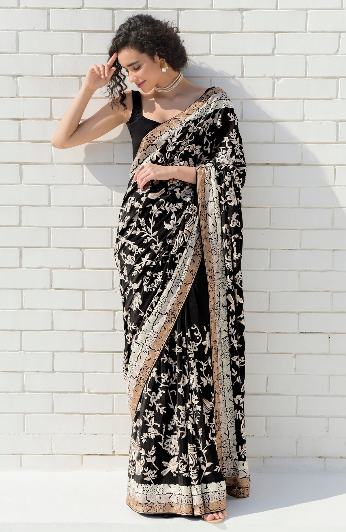 Black saree with hand-embroidered Parsi Gara motifs and three-tier pearl and cream border