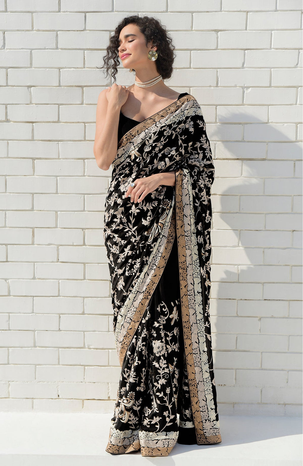 Black saree with hand-embroidered Parsi Gara birds and floral motifs and three-tier border
