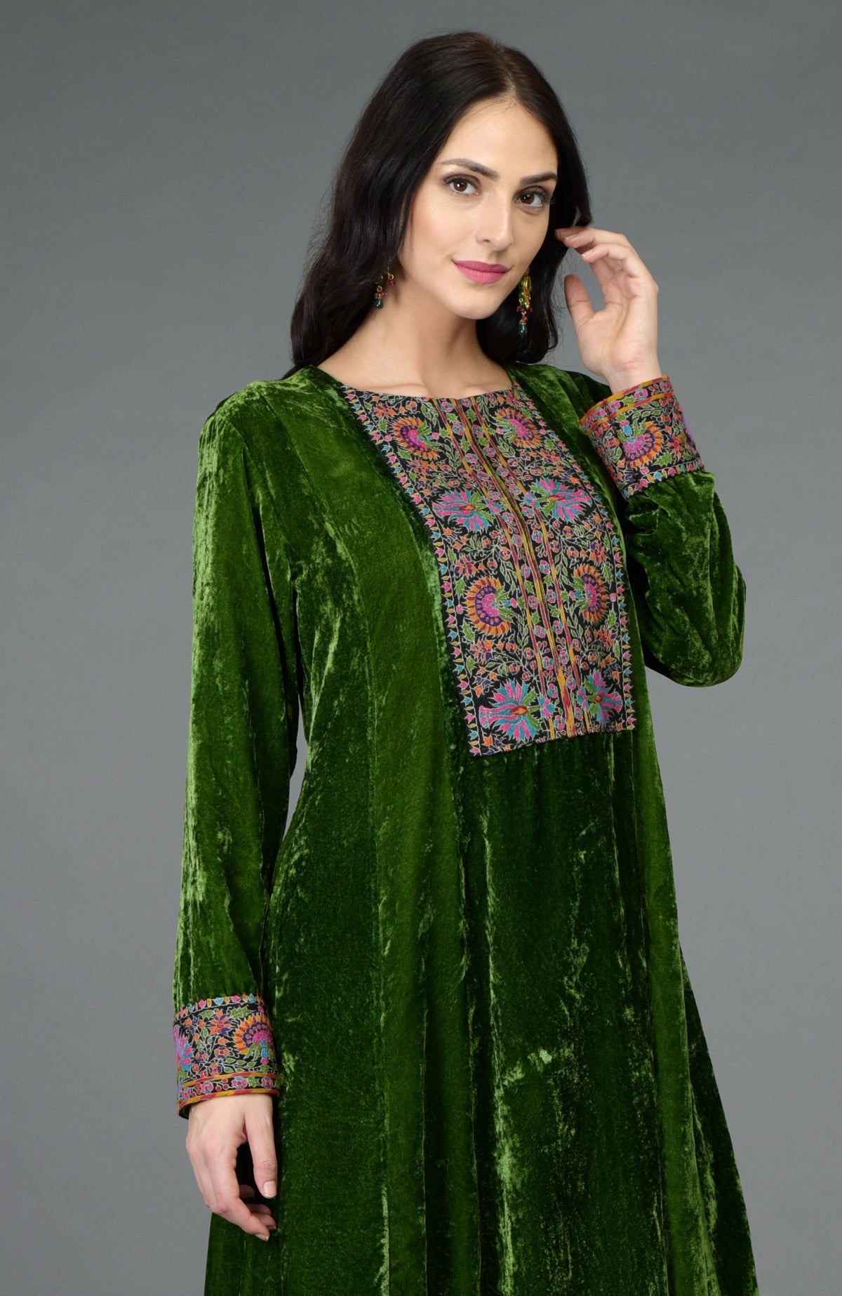 Green silk velvet kurta with asymmetrical hem and multicolor Kashmiri hand embroidery on neckline and sleeves