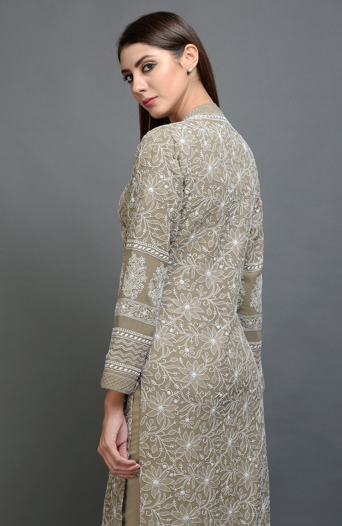 Beige Chikankari embroidered jacket with notch collar and matching beige lowers.
