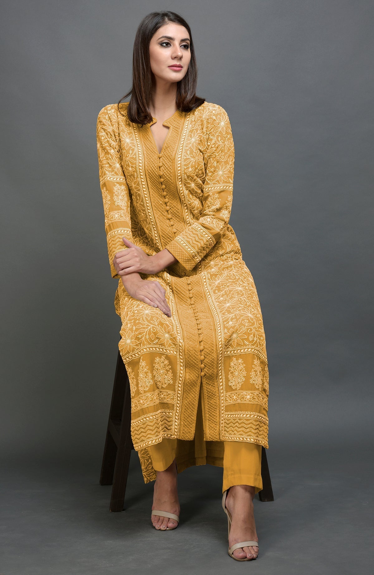 Peanut butter colored jacket with intricate chikankari embroidery and matching lowers.