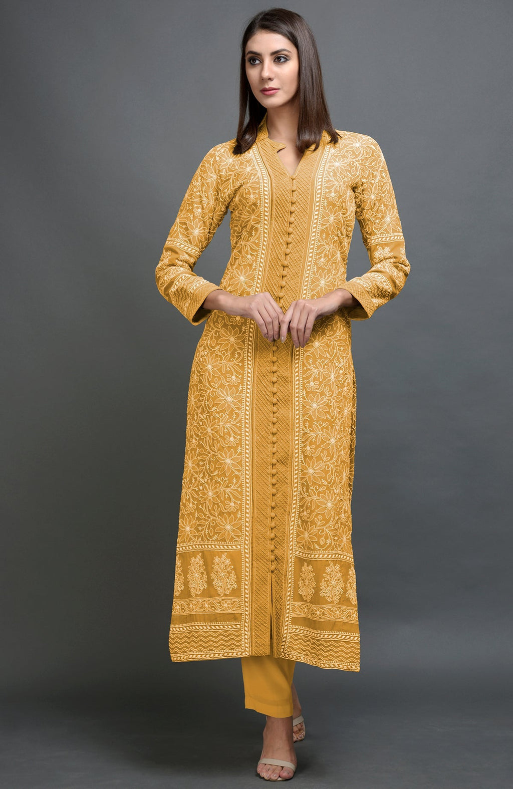 Peanut butter colored jacket with intricate chikankari embroidery and matching lowers.