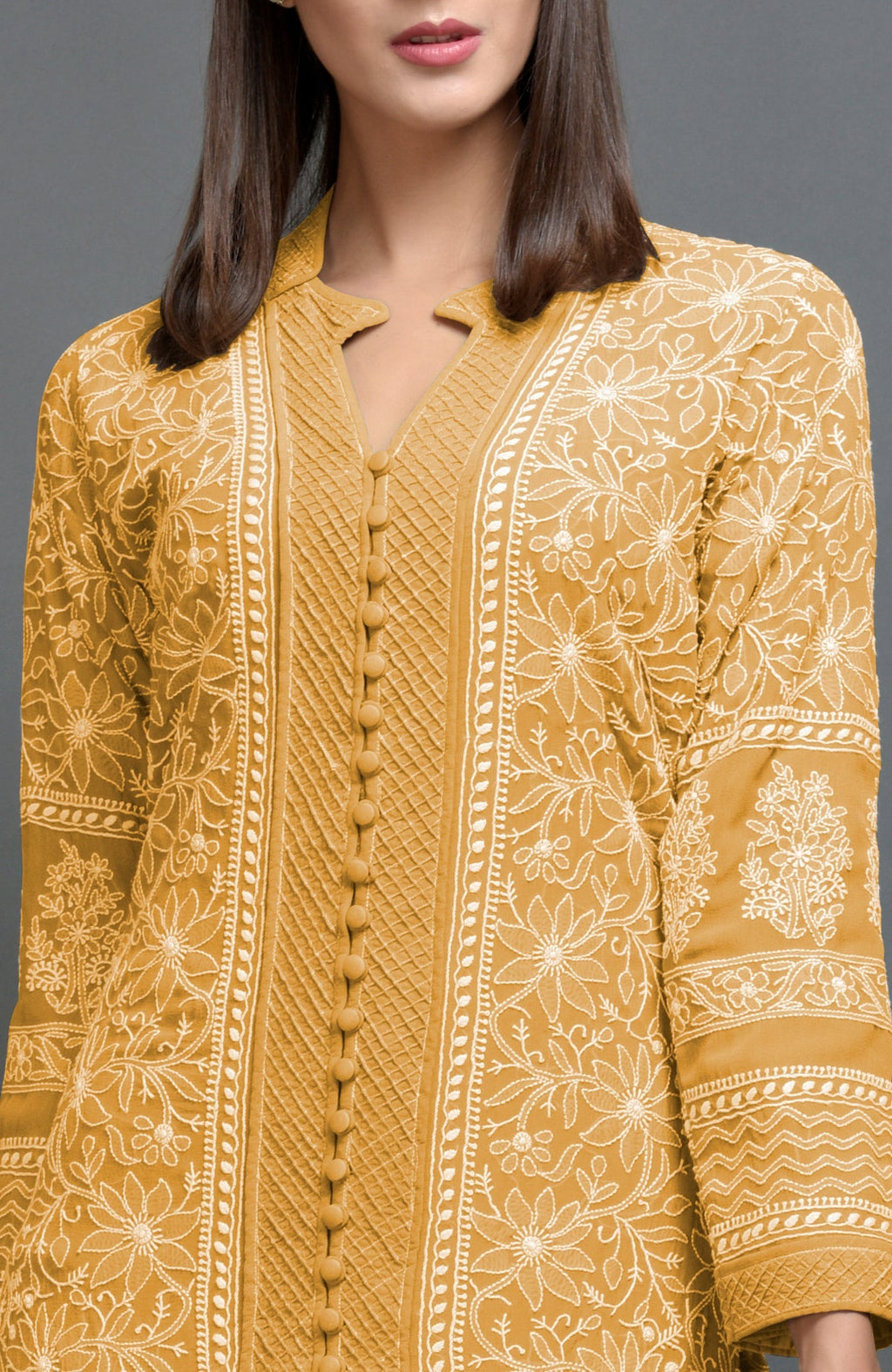 Peanut butter colored jacket set with intricate chikankari embroidery and matching lowers.