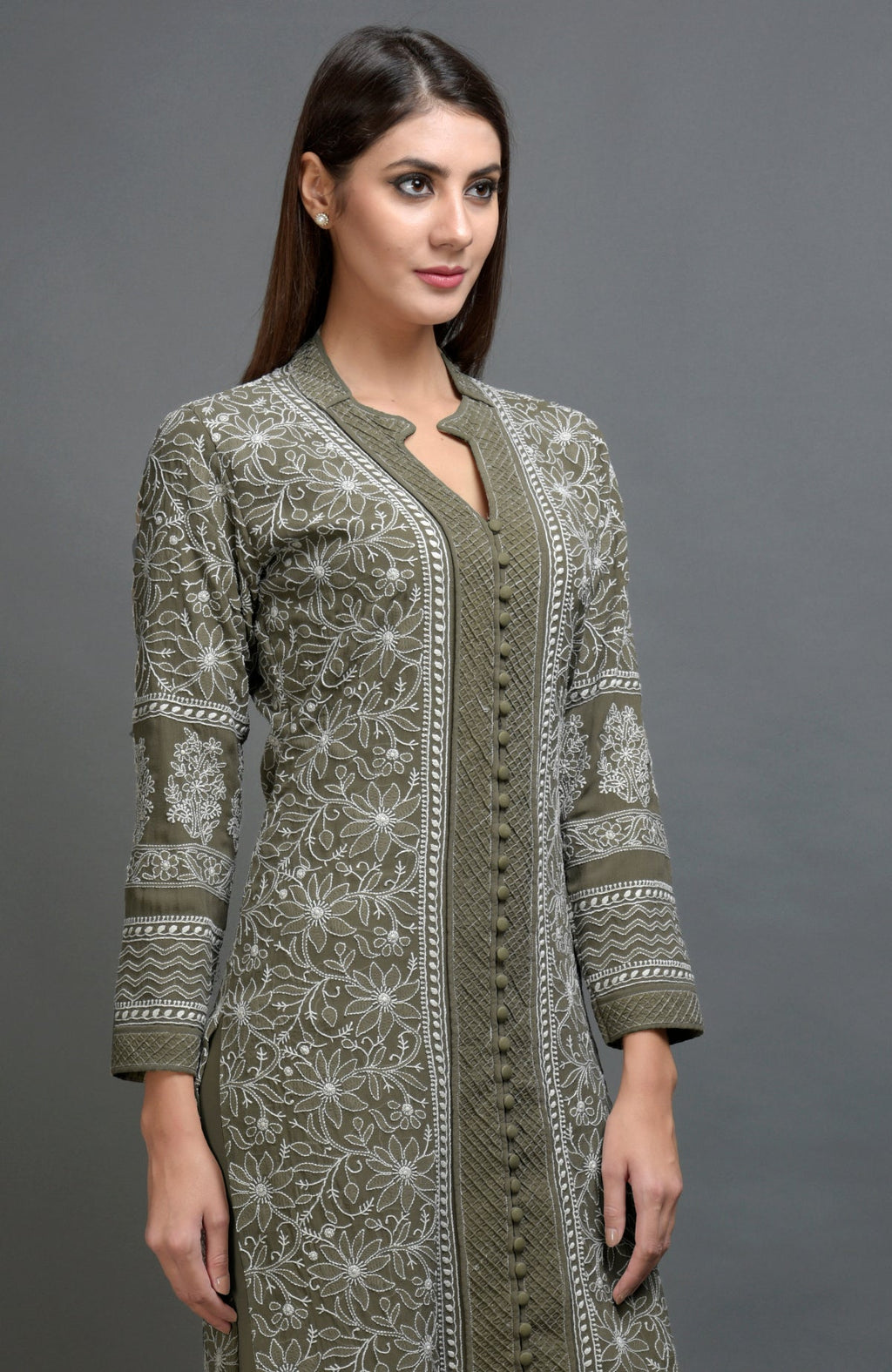 Olive green chikankari embroidered jacket with notch collar and matching olive lowers.