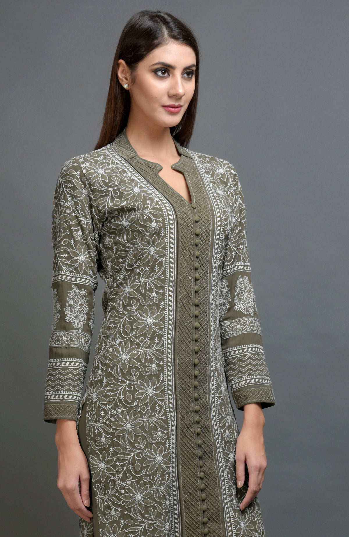 Olive green chikankari embroidered jacket with notch collar and matching olive lowers.