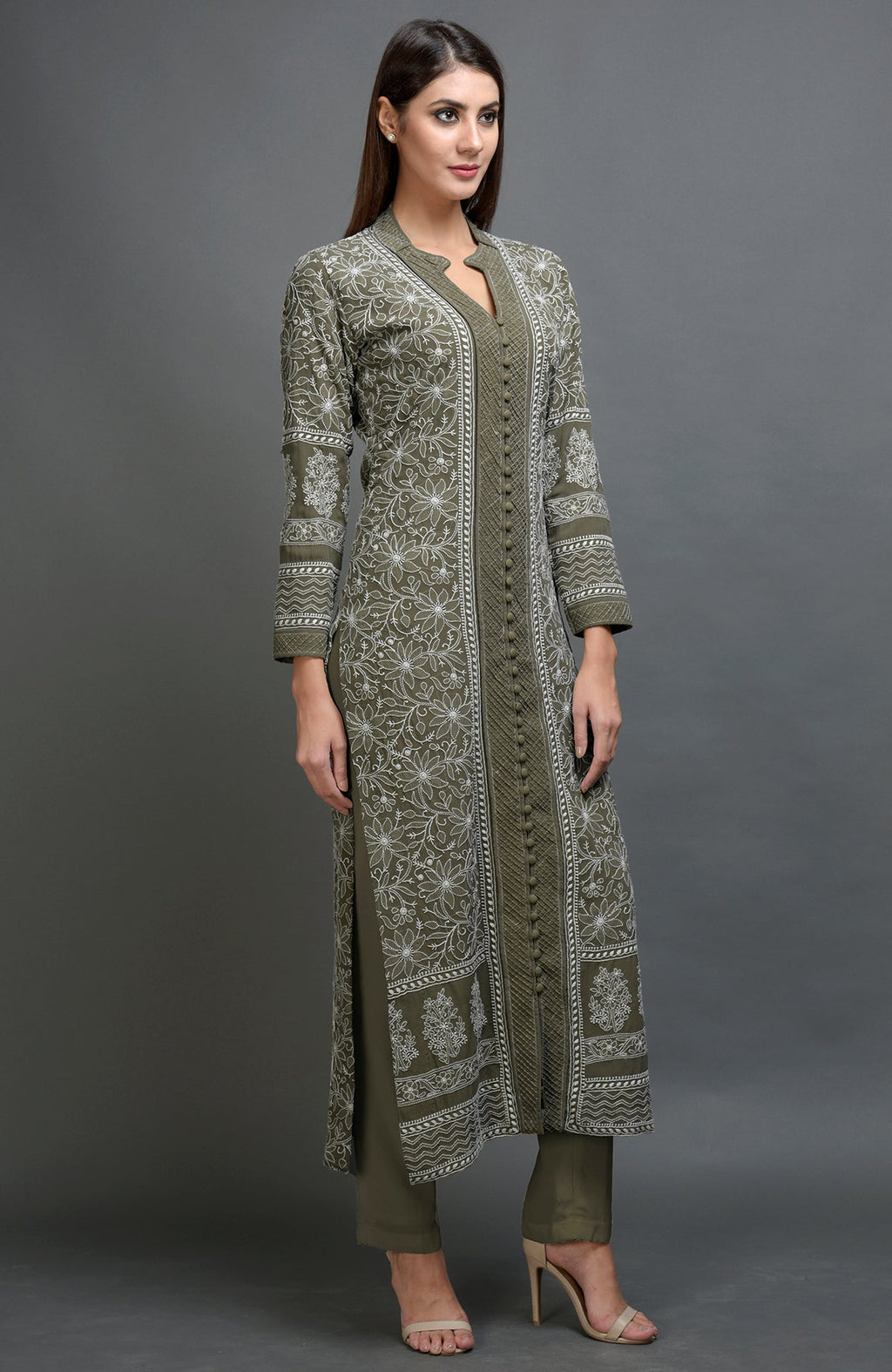 Olive green chikankari embroidered jacket with notch collar and matching lowers.