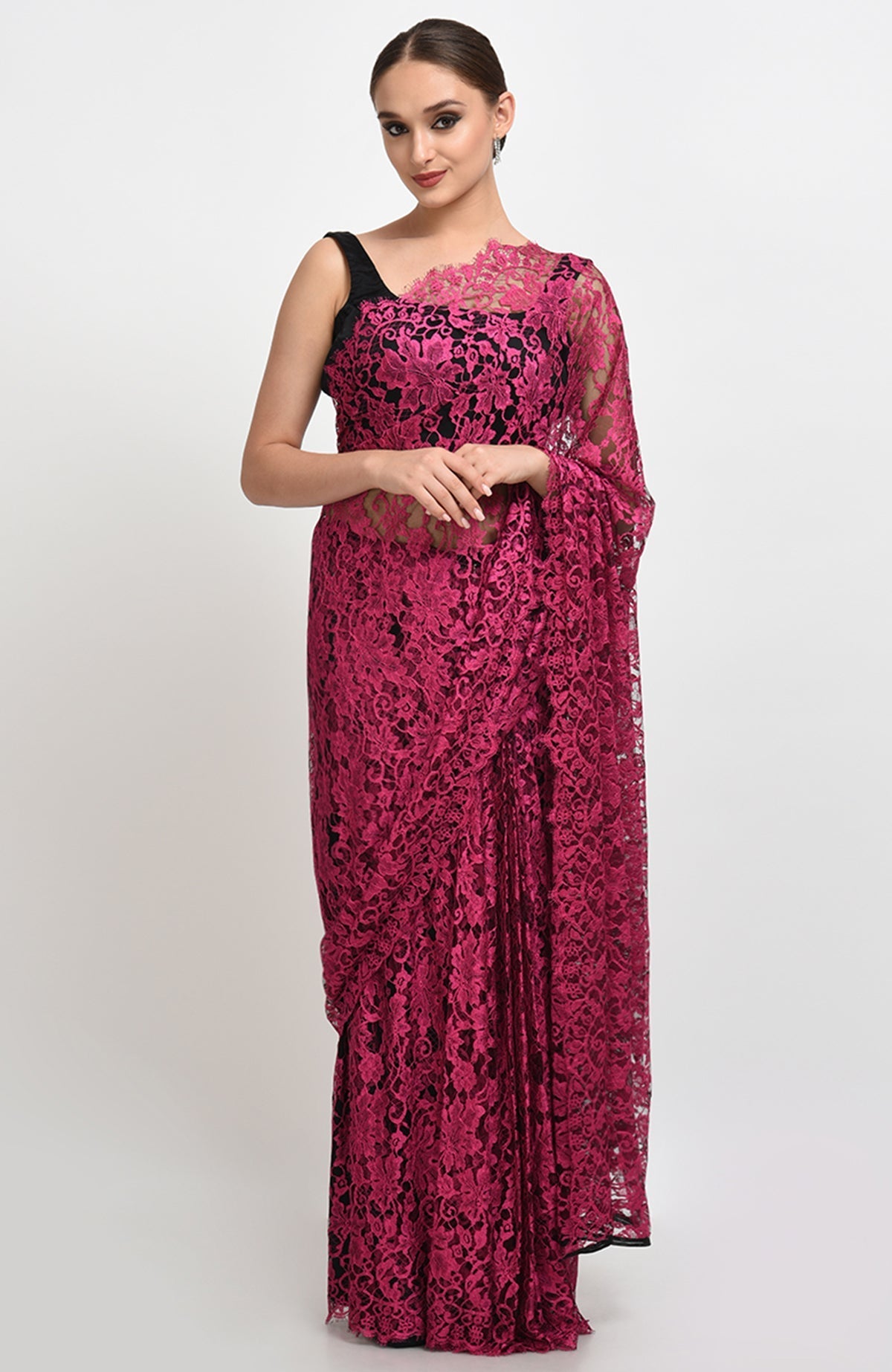 Raspberry saree made of French Chantilly lace with matching satin blouse fabric visible.